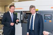 The Prime Minister and Neil Carmichael, MP for Stroud, with a Renishaw AM250 additive manufacturing (metal 3D printing) machine